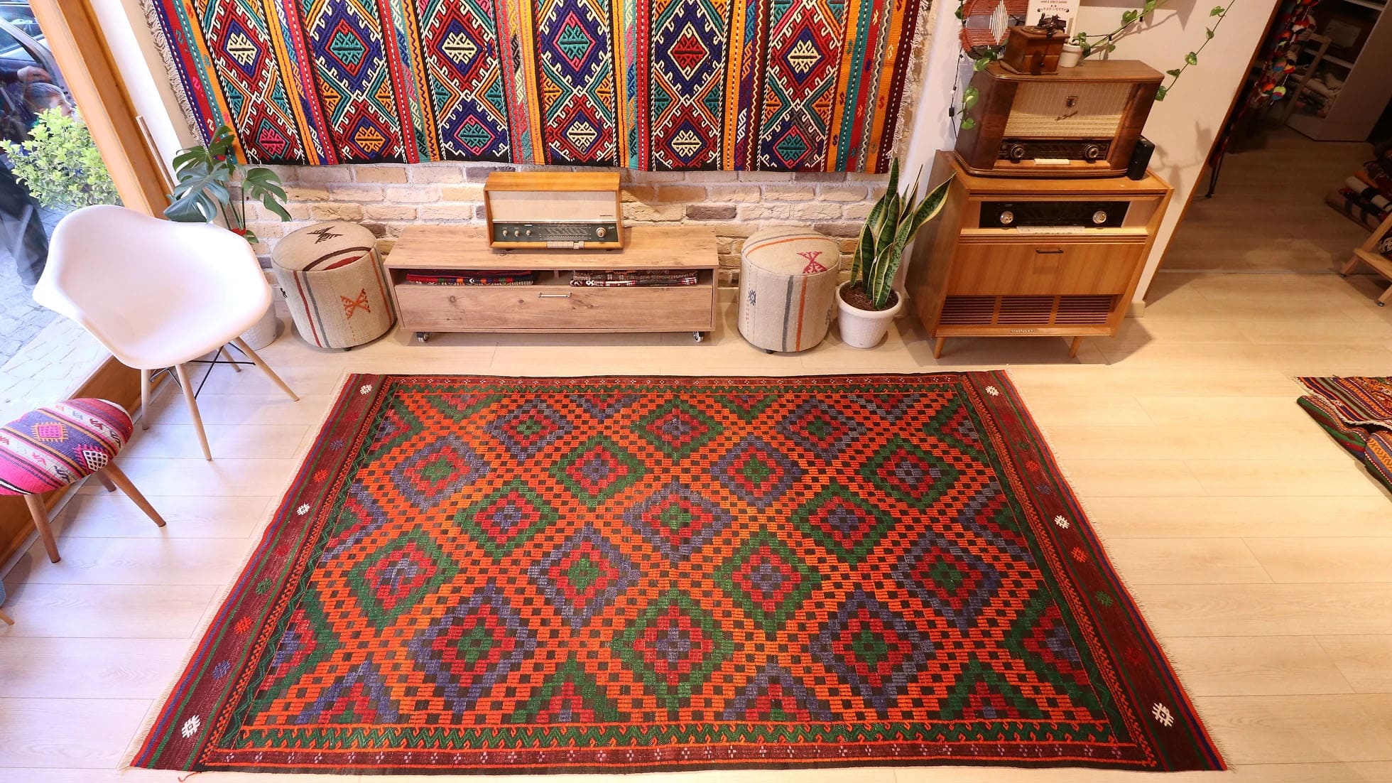 Vintage Turkish Cecim kilim rug from Manisa, 5x9 ft, handwoven in the 1970s using the rare cecim/jijim technique. Features lozenge motifs in burnt sienna, emerald green, royal purple, and fiery orange, with symbolic 'burdock' and 'running water' motifs, reflecting sustainable craftsmanship and cultural heritage.