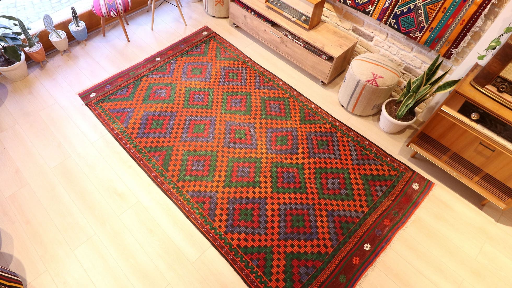 Vintage Turkish Cecim kilim rug from Manisa, 5x9 ft, handwoven in the 1970s using the rare cecim/jijim technique. Features lozenge motifs in burnt sienna, emerald green, royal purple, and fiery orange, with symbolic 'burdock' and 'running water' motifs, reflecting sustainable craftsmanship and cultural heritage.