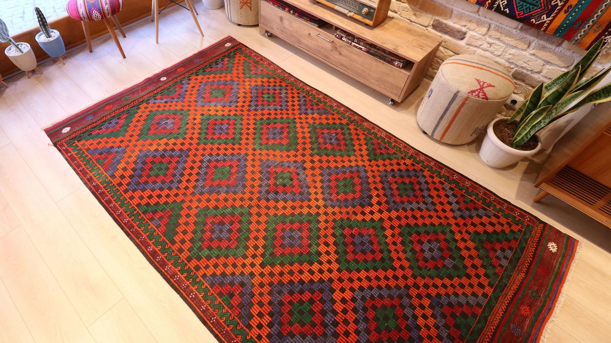 Vintage Turkish Cecim kilim rug from Manisa, 5x9 ft, handwoven in the 1970s using the rare cecim/jijim technique. Features lozenge motifs in burnt sienna, emerald green, royal purple, and fiery orange, with symbolic 'burdock' and 'running water' motifs, reflecting sustainable craftsmanship and cultural heritage.