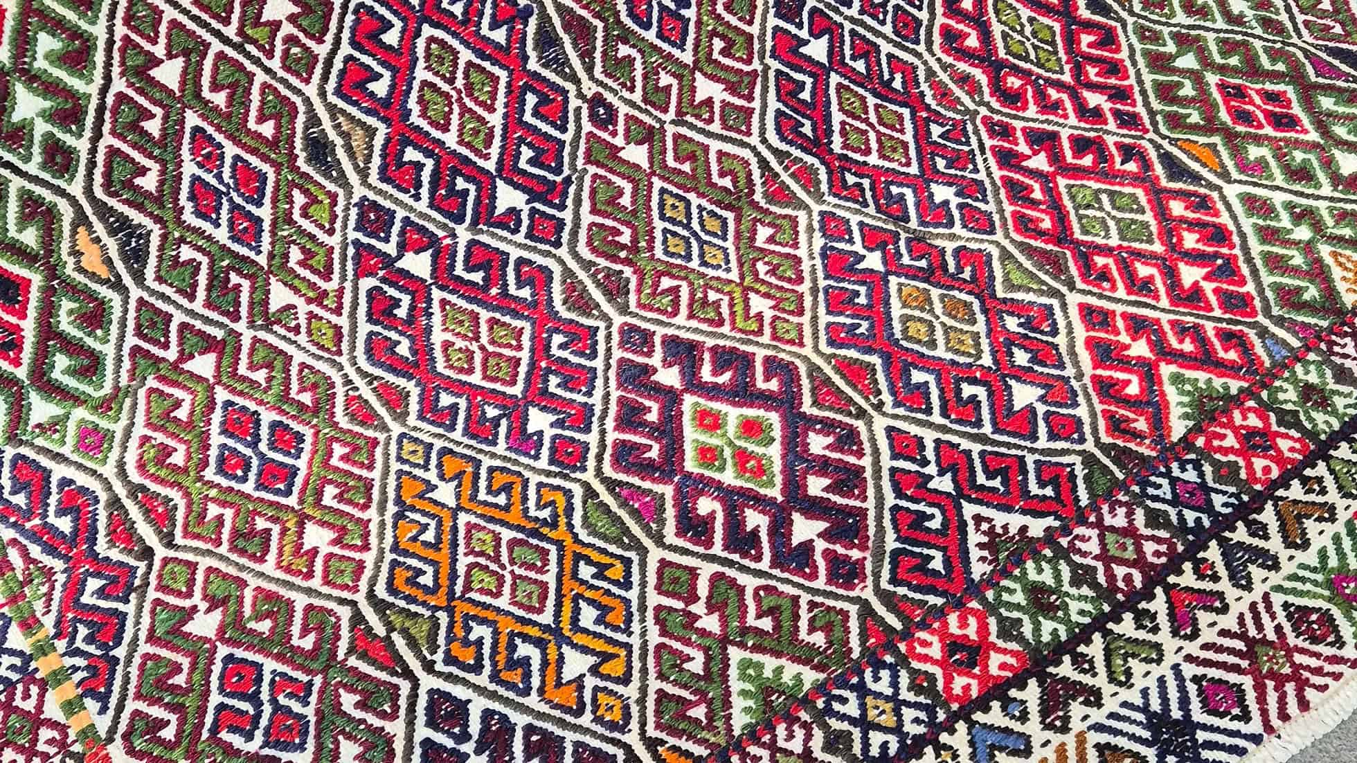 Close-up of one-of-a-kind vintage Turkish cecim rug with playful contemporary palette by Kilim Couture New York Rug Gallery