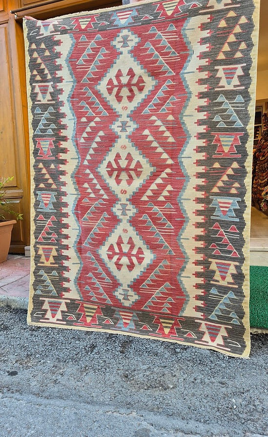 Vintage Turkish Oushak kilim with warm earthy tones and geometric Southwestern patterns, perfect for boho, modern rustic, or curated designer interiors.