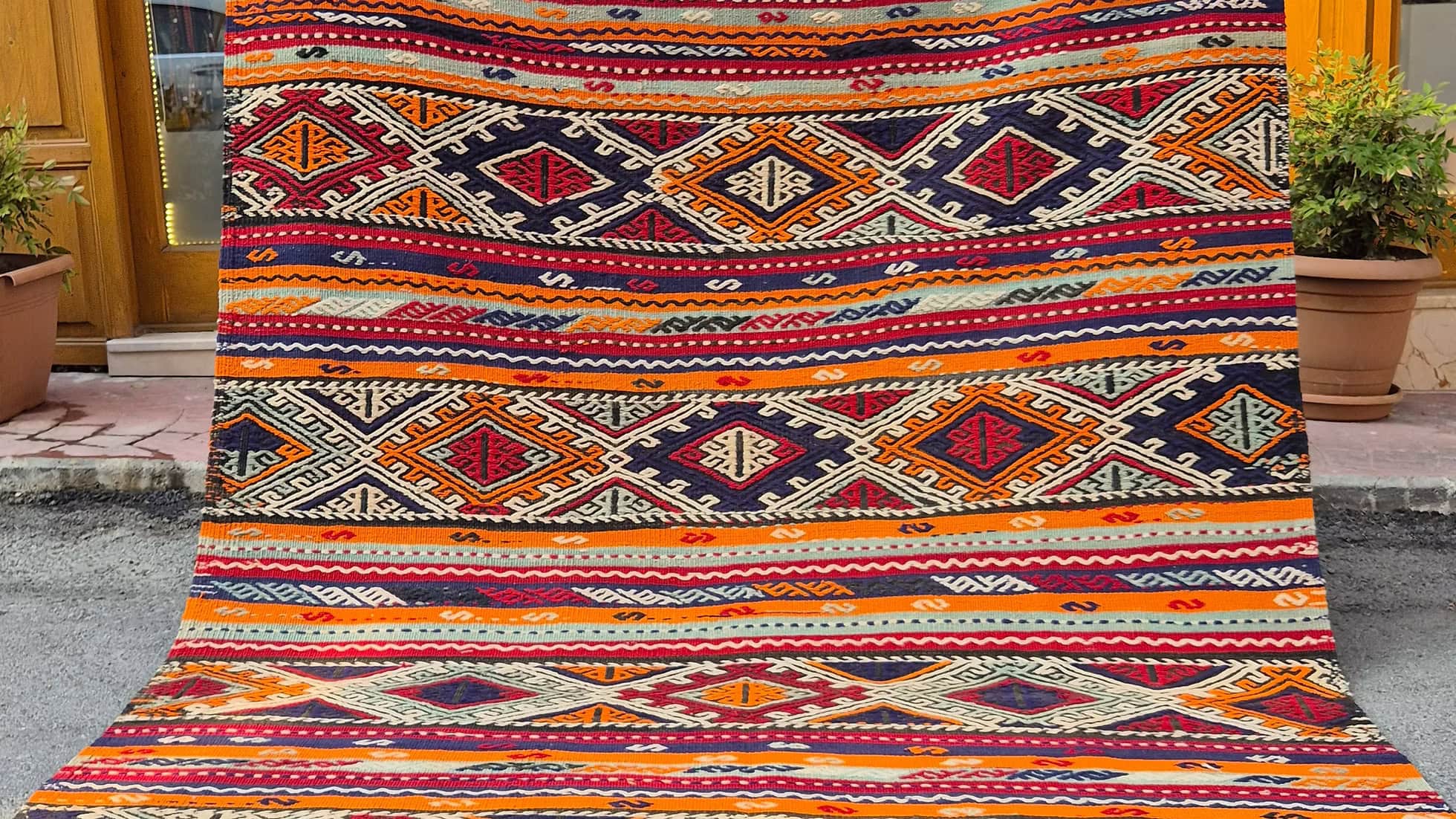 Handwoven vintage Manisa Cecim Kilim rug showcasing richly textured tribal geometric patterns.