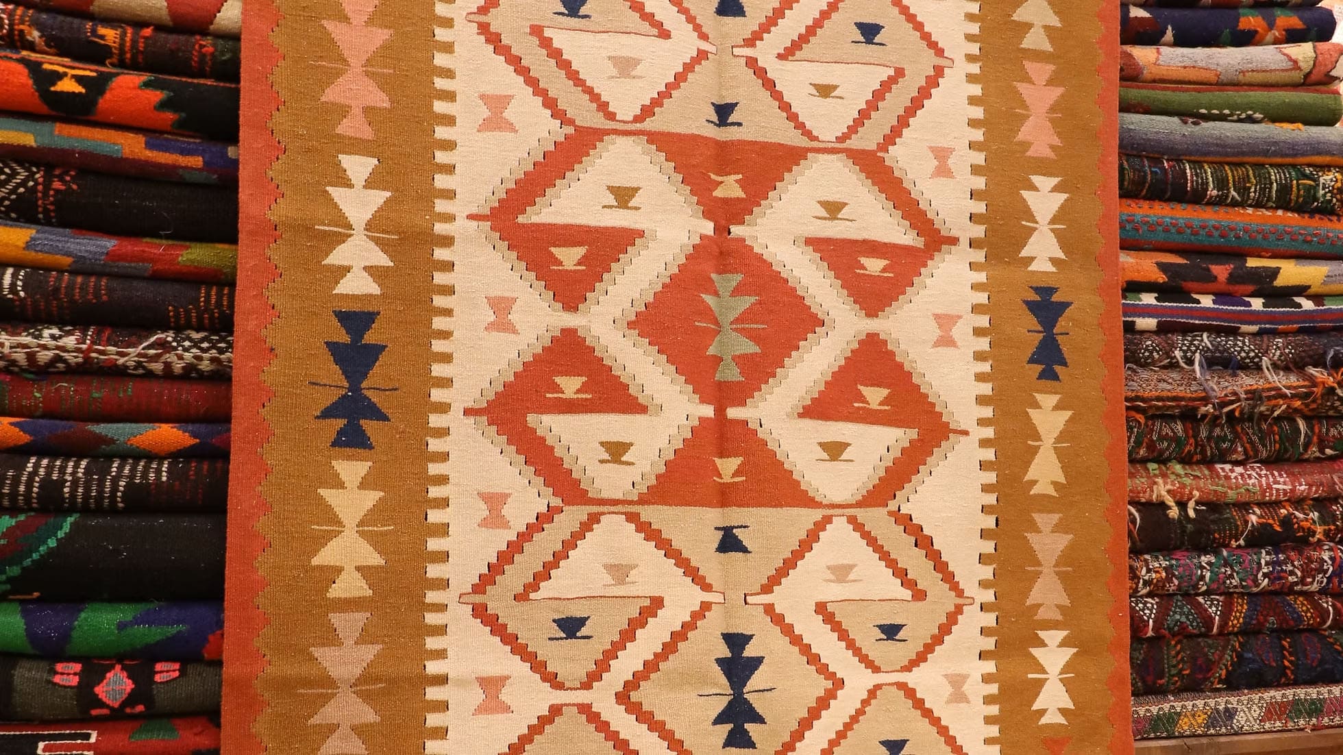 Vintage 1970s Turkish kilim rug, flatwoven wool small area rug with geometric tribal patterns in warm earthy tones, ideal for eclectic, boho, farmhouse, or transitional decor.