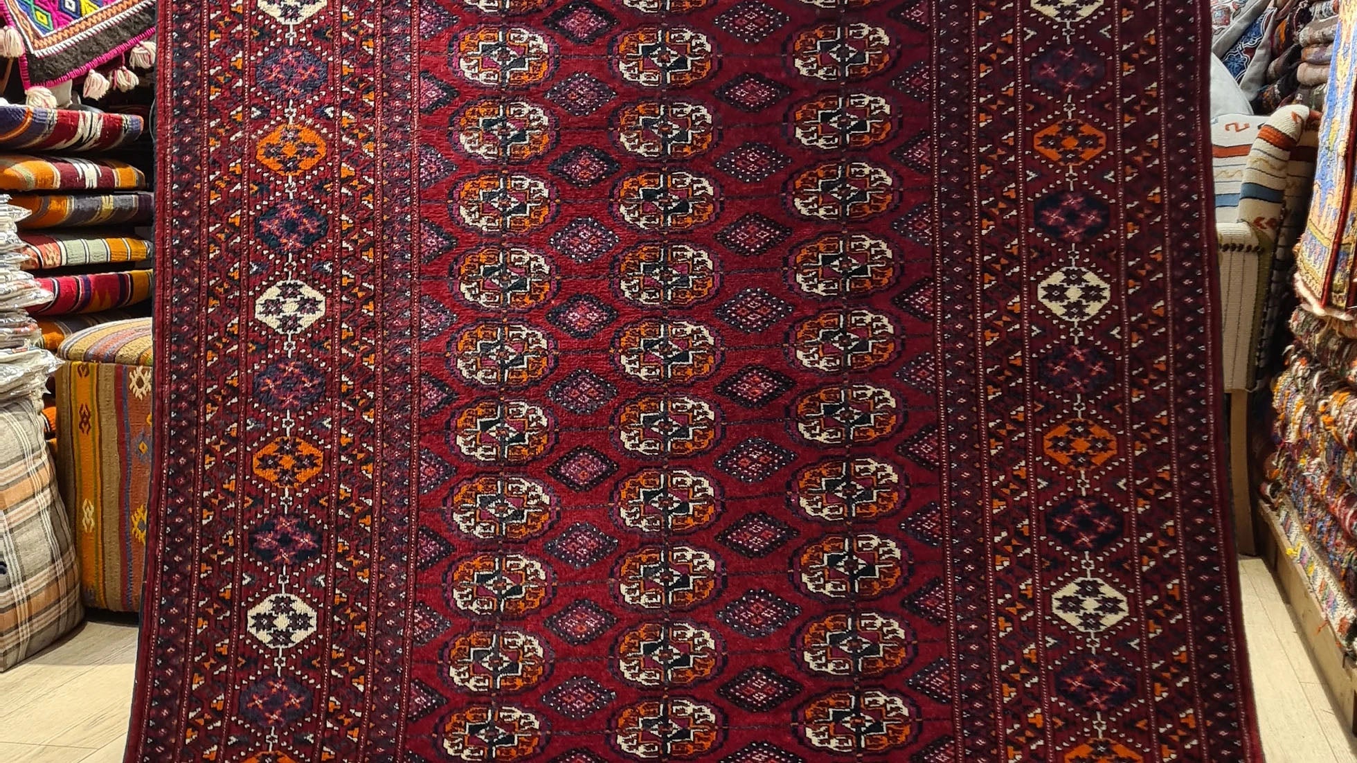 Handwoven Vintage Turkmen Bokhara Oriental Rug with Gul Medallions – A luxurious 1960s wool rug in burgundy and ivory hues, from Kilim Couture New York rug gallery.